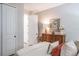 Bright bedroom with hardwood floors, a spacious closet, and plenty of natural light at 1815 Sunset Wind Loop # 118, Oldsmar, FL 34677