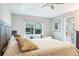 Bright bedroom featuring a king bed and ensuite bathroom access at 1815 Sunset Wind Loop # 118, Oldsmar, FL 34677
