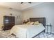 Main bedroom with king bed, dresser and plenty of natural light at 1815 Sunset Wind Loop # 118, Oldsmar, FL 34677