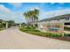 Entrance to Bayside Terrace with palm trees and signage at 1815 Sunset Wind Loop # 118, Oldsmar, FL 34677