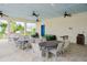 Outdoor grilling station with seating and tables for residents at 1815 Sunset Wind Loop # 118, Oldsmar, FL 34677