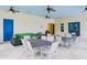 Relaxing outdoor space with tables, chairs, and a sofa at 1815 Sunset Wind Loop # 118, Oldsmar, FL 34677