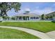 Community pool and expansive lawn area at 1815 Sunset Wind Loop # 118, Oldsmar, FL 34677