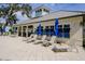 Pool area with lounge chairs and blue umbrellas at 1815 Sunset Wind Loop # 118, Oldsmar, FL 34677