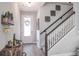 Bright entryway with modern staircase and wine storage at 1815 Sunset Wind Loop # 118, Oldsmar, FL 34677