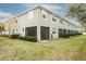 Tan building with multiple units and a grassy yard at 1815 Sunset Wind Loop # 118, Oldsmar, FL 34677