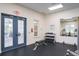 Fitness center with weight bench and dumbbells at 1815 Sunset Wind Loop # 118, Oldsmar, FL 34677
