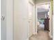 A well-lit hallway with carpeted floors and access to bedrooms at 1815 Sunset Wind Loop # 118, Oldsmar, FL 34677