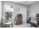 Home office with window, comfortable chair and printer at 1815 Sunset Wind Loop # 118, Oldsmar, FL 34677