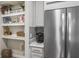 Built-in kitchen shelves and coffee bar with stainless steel appliances at 1815 Sunset Wind Loop # 118, Oldsmar, FL 34677