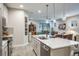 Open concept kitchen with large island, stainless steel appliances, and a view of the living room at 1815 Sunset Wind Loop # 118, Oldsmar, FL 34677