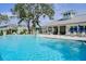 Inviting community pool with plenty of lounge chairs at 1815 Sunset Wind Loop # 118, Oldsmar, FL 34677