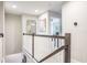 Upstairs hallway with access to bedrooms and bathrooms at 1815 Sunset Wind Loop # 118, Oldsmar, FL 34677