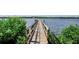 Long wooden dock extending into the water at 1815 Sunset Wind Loop # 118, Oldsmar, FL 34677