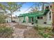 Landscaped backyard with stone pathway and shed at 200 57Th S Ave, St Petersburg, FL 33705