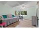 Bright bedroom with daybed, workspace, and light wood flooring at 200 57Th S Ave, St Petersburg, FL 33705