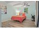 Bedroom with coral bedding, workspace, and built-in shelving at 200 57Th S Ave, St Petersburg, FL 33705