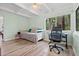 Multi-purpose bedroom with daybed, workspace, and ample natural light at 200 57Th S Ave, St Petersburg, FL 33705