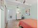 Light and airy bedroom with built-in shelving and a dresser at 200 57Th S Ave, St Petersburg, FL 33705