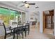 Dining area with table and chairs, view into living room and kitchen at 200 57Th S Ave, St Petersburg, FL 33705