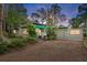 House exterior at dusk showcasing landscaping and architecture at 200 57Th S Ave, St Petersburg, FL 33705