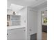 White hallway with built-in storage and access to other rooms at 200 57Th S Ave, St Petersburg, FL 33705