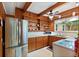 Kitchen with stainless steel appliances and wood cabinets at 200 57Th S Ave, St Petersburg, FL 33705