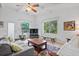 Bright living room with hardwood floors, sofa, and a large window at 200 57Th S Ave, St Petersburg, FL 33705
