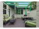 Relaxing patio with fire pit and seating area under a pergola at 200 57Th S Ave, St Petersburg, FL 33705