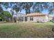 Spacious backyard featuring a screened pool and patio area at 2342 Edelweiss Loop, Trinity, FL 34655