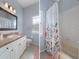 Updated bathroom with a tub, shower, and vanity with a large mirror at 2342 Edelweiss Loop, Trinity, FL 34655