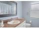 Clean bathroom with a single sink vanity, a toilet, and a shower/tub combo at 2342 Edelweiss Loop, Trinity, FL 34655