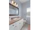 Clean bathroom with a single sink vanity, a toilet, and a shower/tub combo at 2342 Edelweiss Loop, Trinity, FL 34655