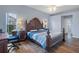 Bedroom with king-size bed, dresser, and home office at 2342 Edelweiss Loop, Trinity, FL 34655