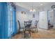 Cozy breakfast nook with glass table and four chairs at 2342 Edelweiss Loop, Trinity, FL 34655