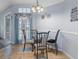 Cozy breakfast nook with glass table and four chairs at 2342 Edelweiss Loop, Trinity, FL 34655