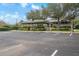 Community pavilion with covered seating and parking area at 2342 Edelweiss Loop, Trinity, FL 34655