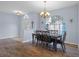 Elegant dining room with hardwood floors and a chandelier at 2342 Edelweiss Loop, Trinity, FL 34655
