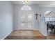 Bright entryway with double doors and tile flooring at 2342 Edelweiss Loop, Trinity, FL 34655