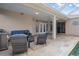 Outdoor patio area with seating and access to the pool at 2342 Edelweiss Loop, Trinity, FL 34655