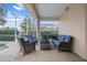 Relaxing patio with wicker furniture and grill, overlooking the pool at 2342 Edelweiss Loop, Trinity, FL 34655