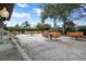 Outdoor patio area with picnic tables for relaxing at 2342 Edelweiss Loop, Trinity, FL 34655