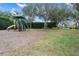 Play area with slides, climbing toys, and wood-chip surface at 2342 Edelweiss Loop, Trinity, FL 34655