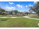 Play area with multiple playsets and picnic tables at 2342 Edelweiss Loop, Trinity, FL 34655