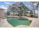 Inviting screened pool area with spa and patio at 2342 Edelweiss Loop, Trinity, FL 34655