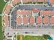 Directly above view of condo complex, pool, and parking at 343 Rex Pl # F, Madeira Beach, FL 33708