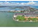 Wide aerial showing waterfront property, homes, and recreational facilities at 343 Rex Pl # F, Madeira Beach, FL 33708