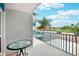 Balcony with glass table and partial view of a baseball field at 343 Rex Pl # F, Madeira Beach, FL 33708