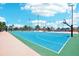 Outdoor basketball court with blue surface, green border, and hoop at 343 Rex Pl # F, Madeira Beach, FL 33708