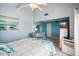 Main bedroom with large bed, dresser, and ceiling fan at 343 Rex Pl # F, Madeira Beach, FL 33708